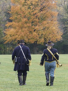 The Colonel and his bugler depart for their assigned positions on field of battle